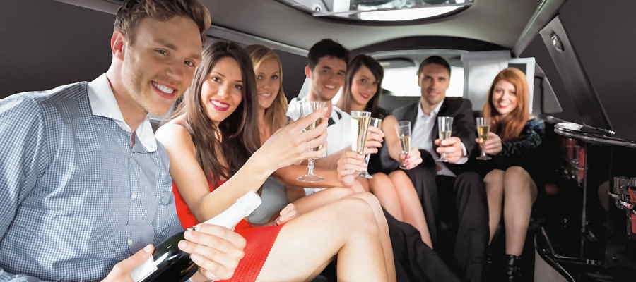 young professionals celebrating in an adult birthday limo